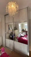 Light artwood panels with large mirror centers with brushed silver frames, installed in Norton